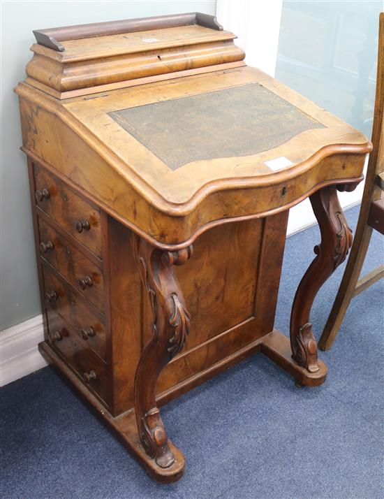 A Victorian walnut serpentine fronted Davenport, H.86cm